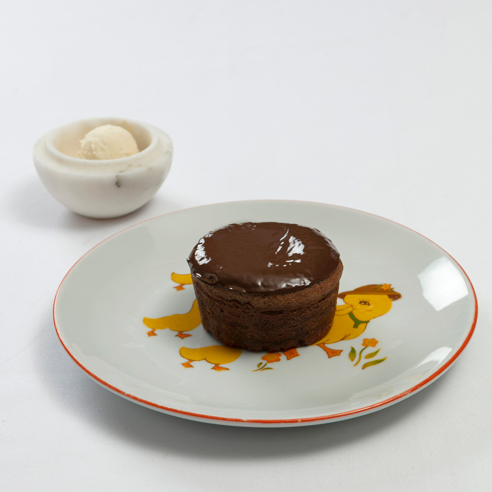 Warm chocolate cake, vanilla ice cream, forest berries compote