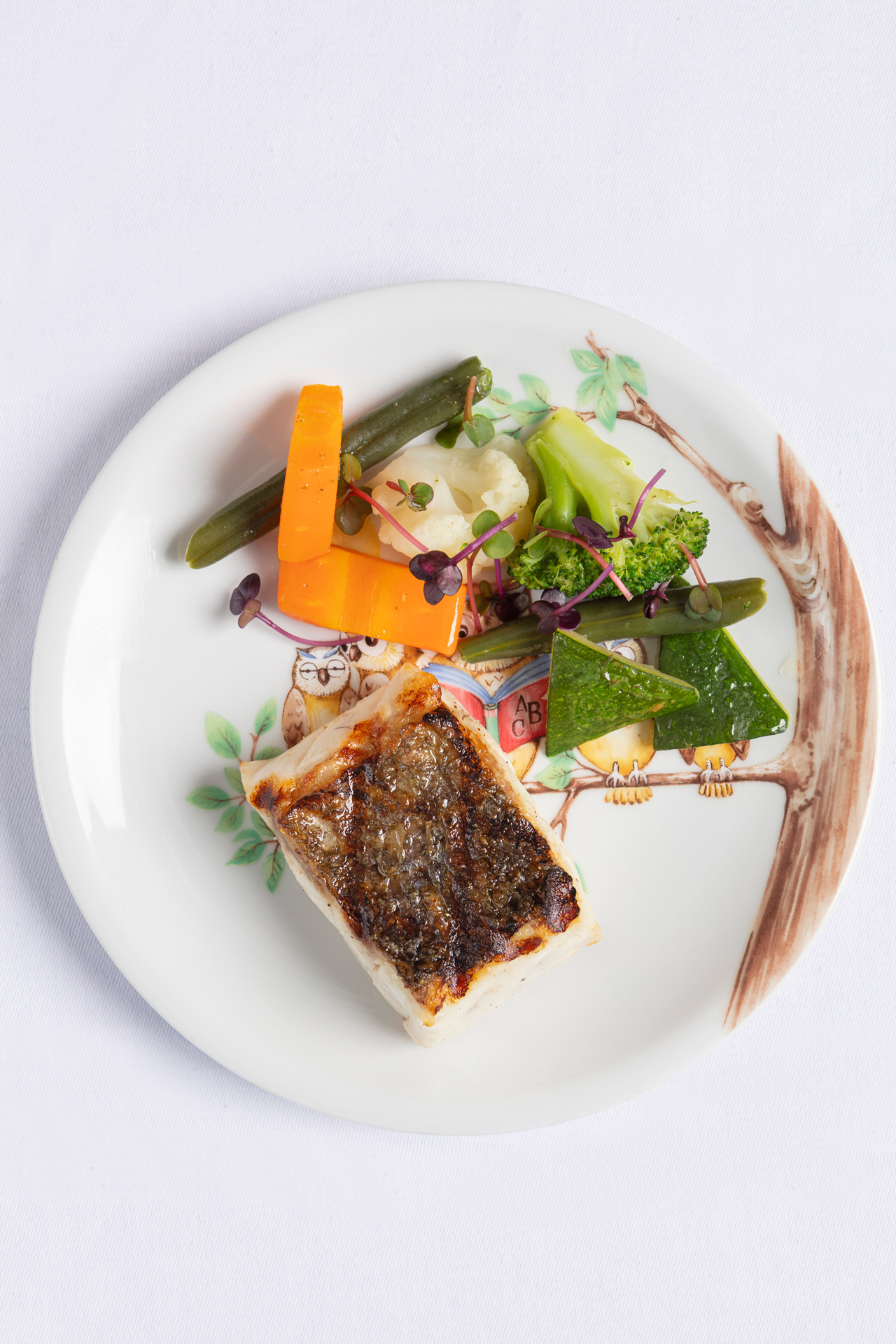 Pan-fried sea bass, seasonal vegetables